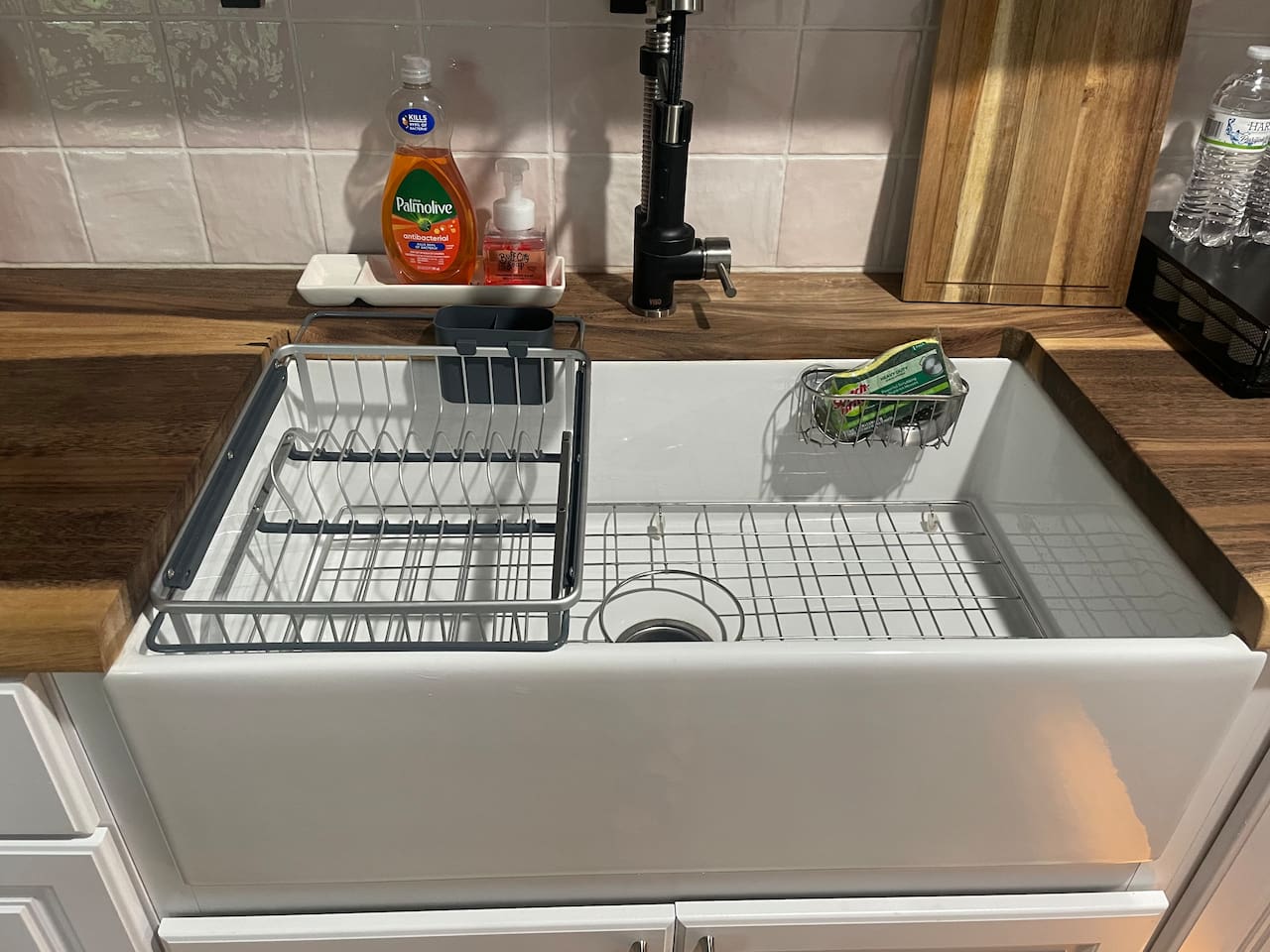 Oversized apron front sink with drying racks make clean up easy. 