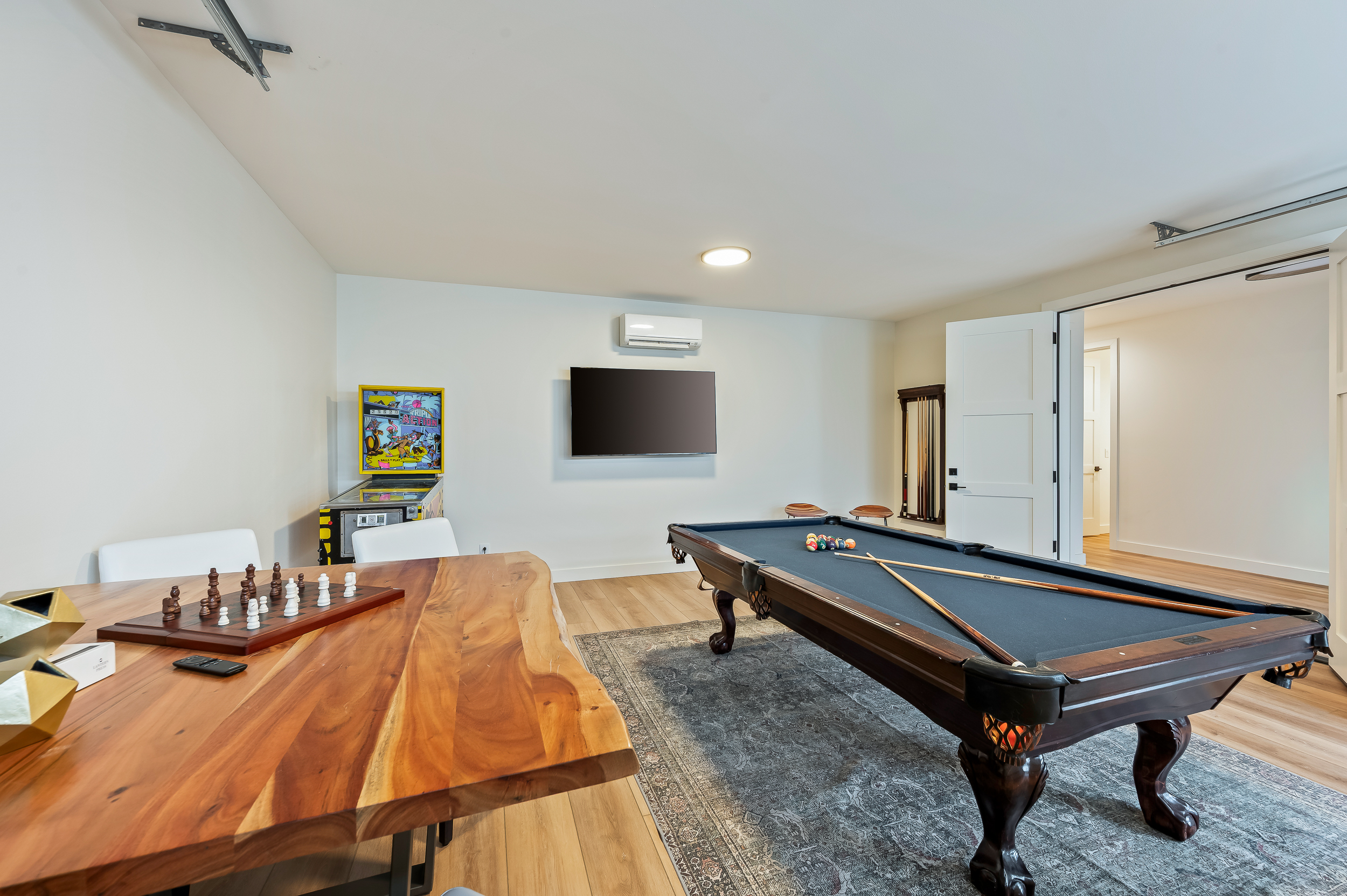Game garage - pool table with convertible top for table tennis, old-school pinball, card table and Smart TV