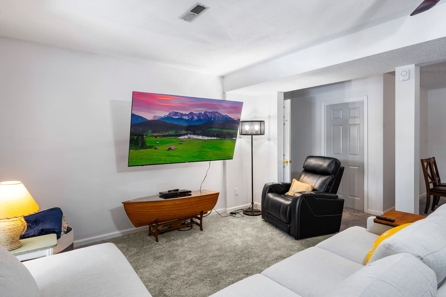 2nd living room located downstairs Infinity Game TableFlat Screen TvPlush Sectional 