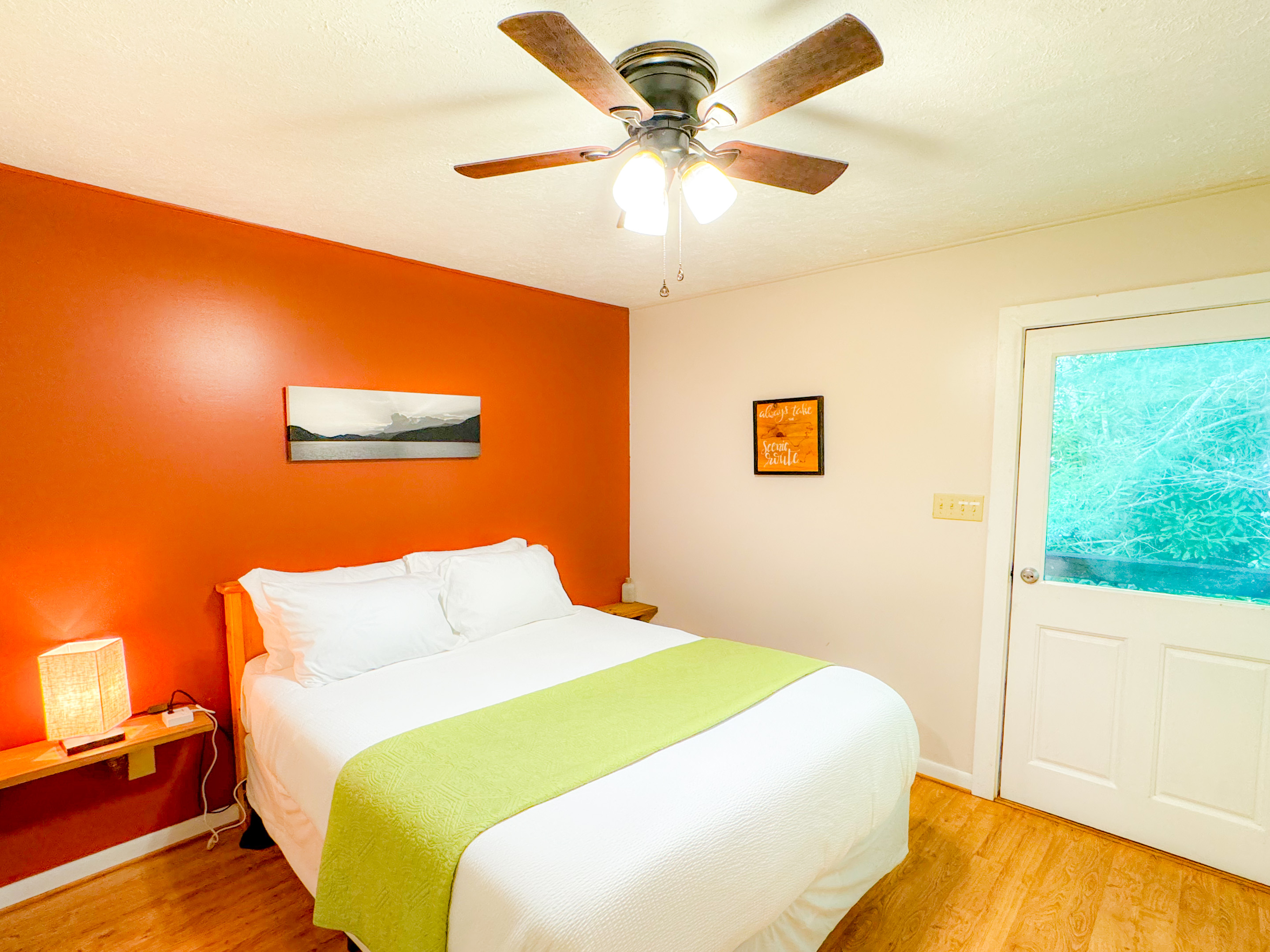 upstairs bedroom at the ol gun range cabin features a comfy queen bed