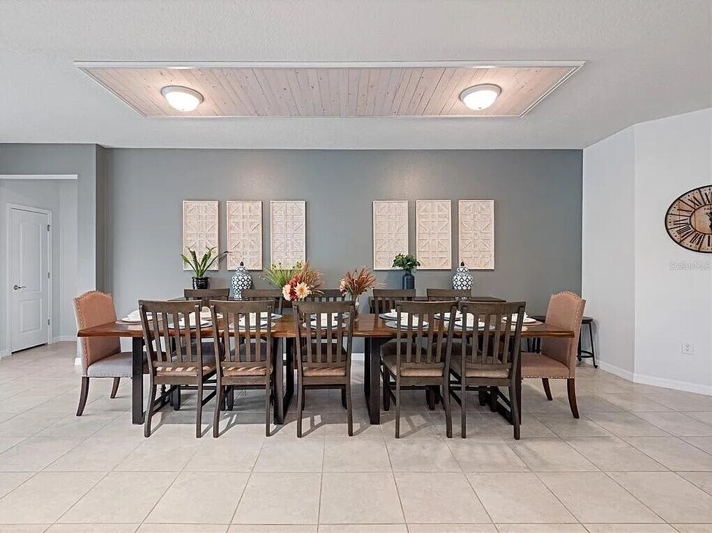 Lovely wood dining room table with seating for 12 plus high-chair if needed