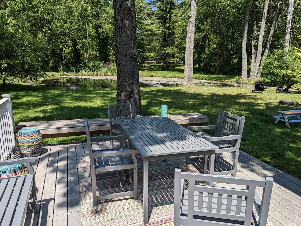 Back deck with pond view.

Enjoy the view with a nice glass of wine, cold beer, hot chocolate or great meal!

Grill available for guest use (not pictured).