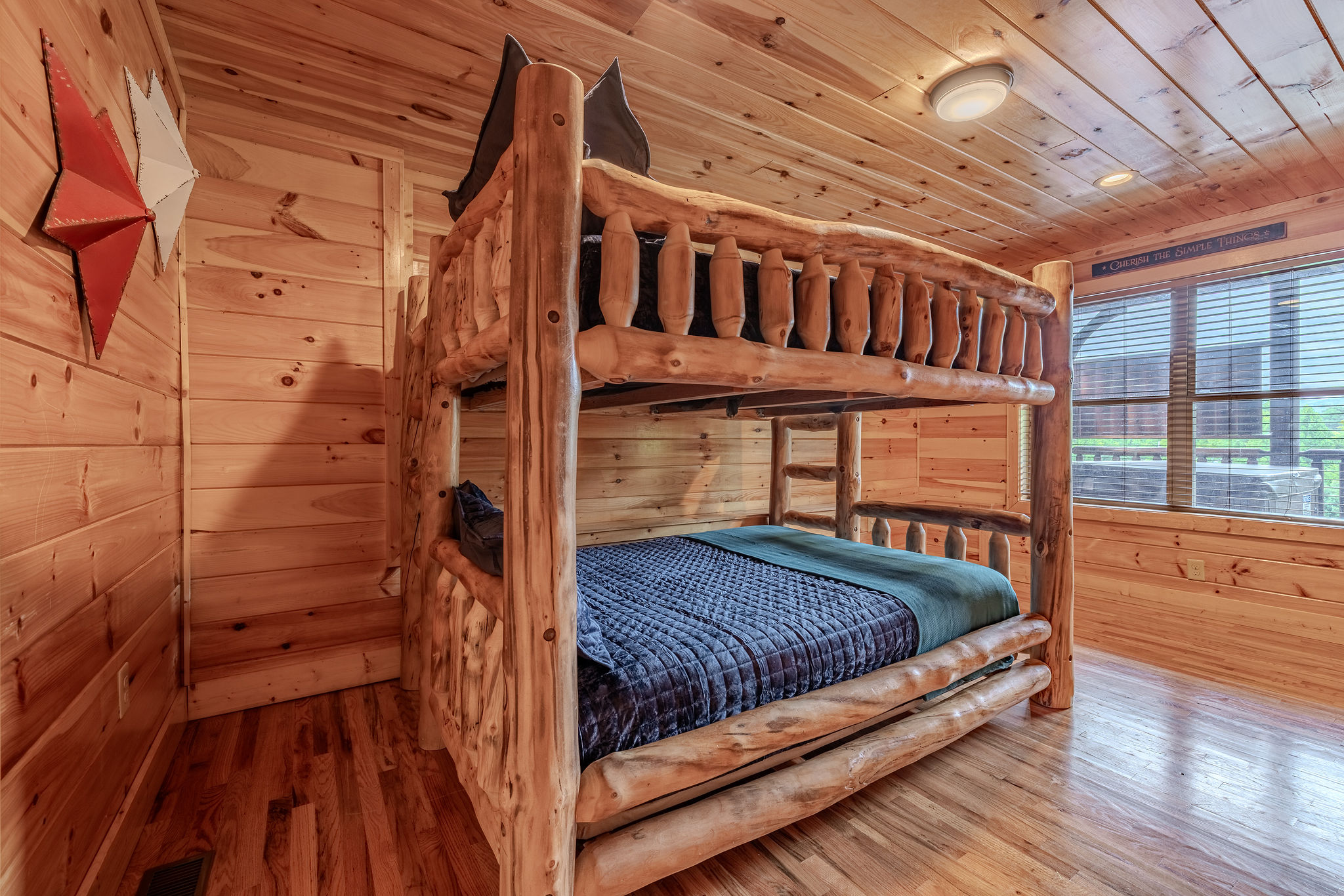 The Roadie Room is the cabin’s bunk room, designed for kids, teens, and adults with a fun tour-crew personality.