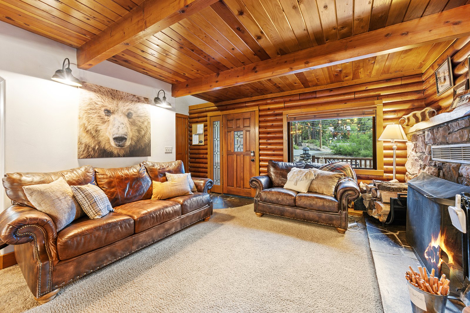 Great room with leather sofas and fireplace