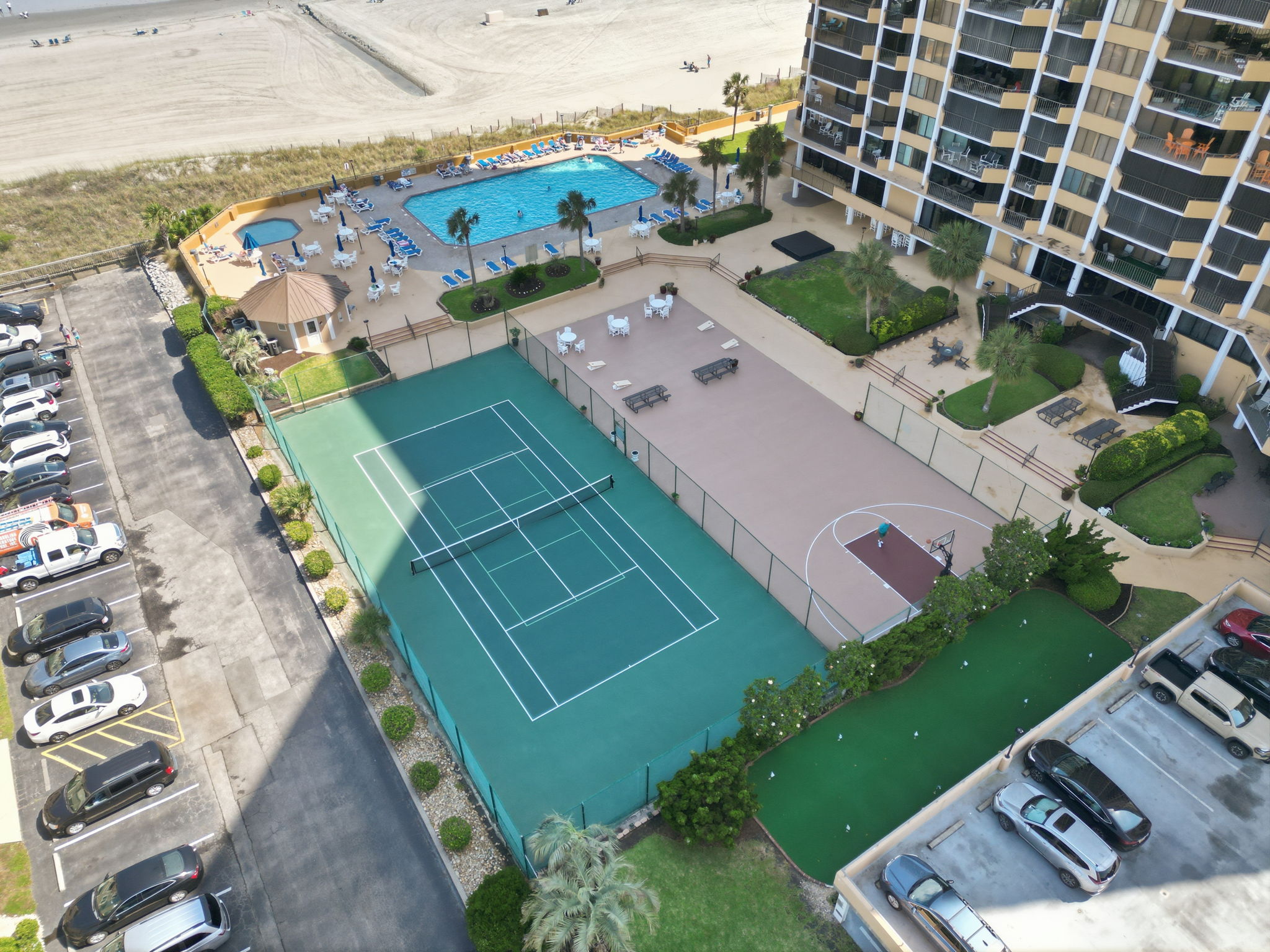 Tennis courts, oceanfront pool, basketball, corn hole and more