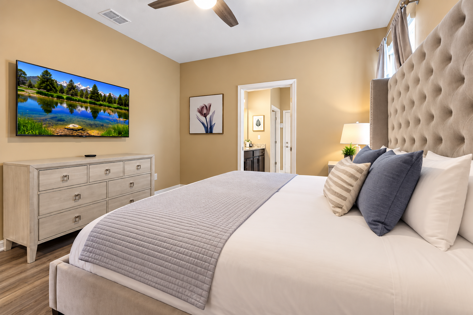 Our king-size master suite has many amenities, including a smart TV, ensuite bathroom, blackout curtains, and luxury linens.