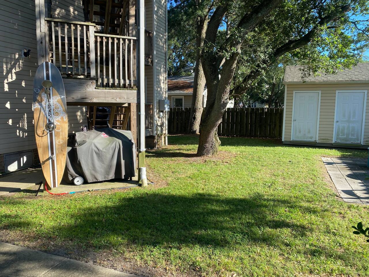 outdoor shower in the back to rinse off after a long day at the beach!