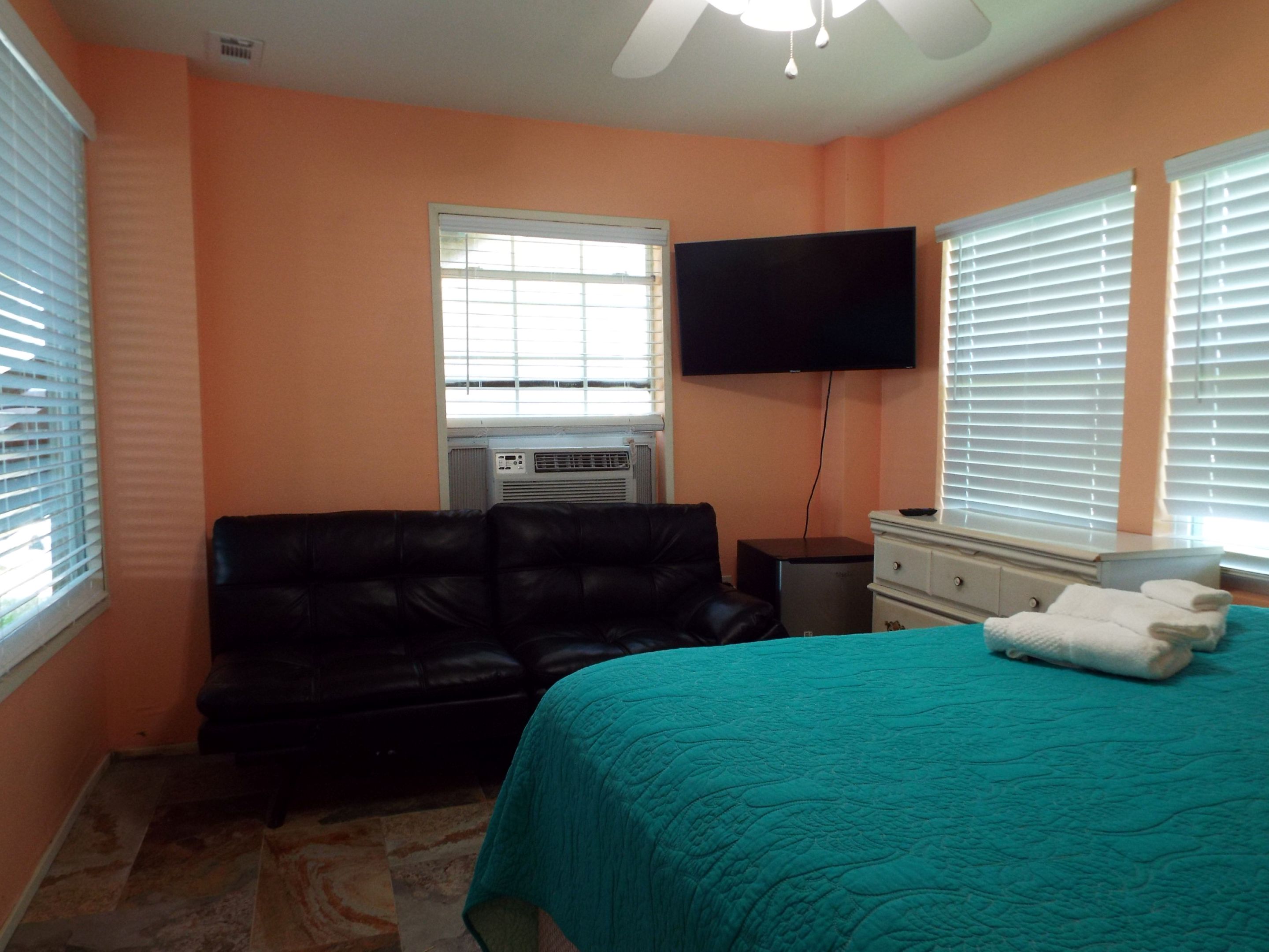 Flat screen TV in the downstairs bedroom