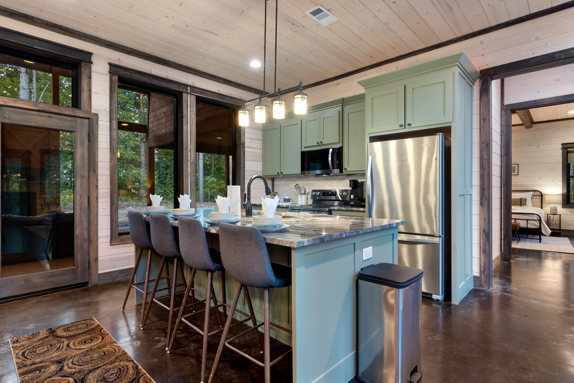 Spacious kitchen island with seating for four, perfect for casual meals, morning coffee, or gathering while cooking together.