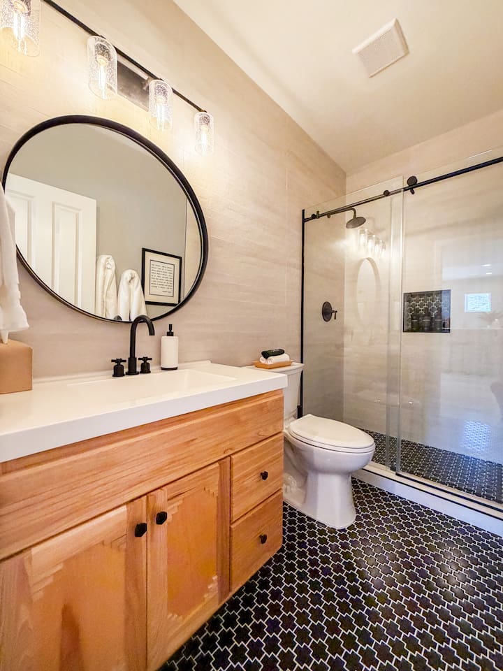 This stylish full bathroom is in our basement, entertainment area complete with shower, soft towels and all the soaps you will need
