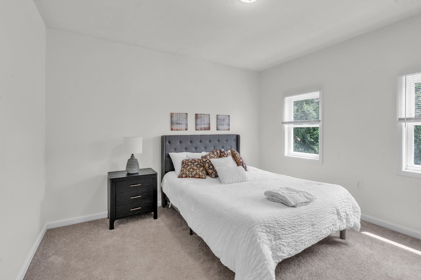 Cozy bedroom featuring a window, allowing natural light to fill the room and create a warm, inviting atmosphere.