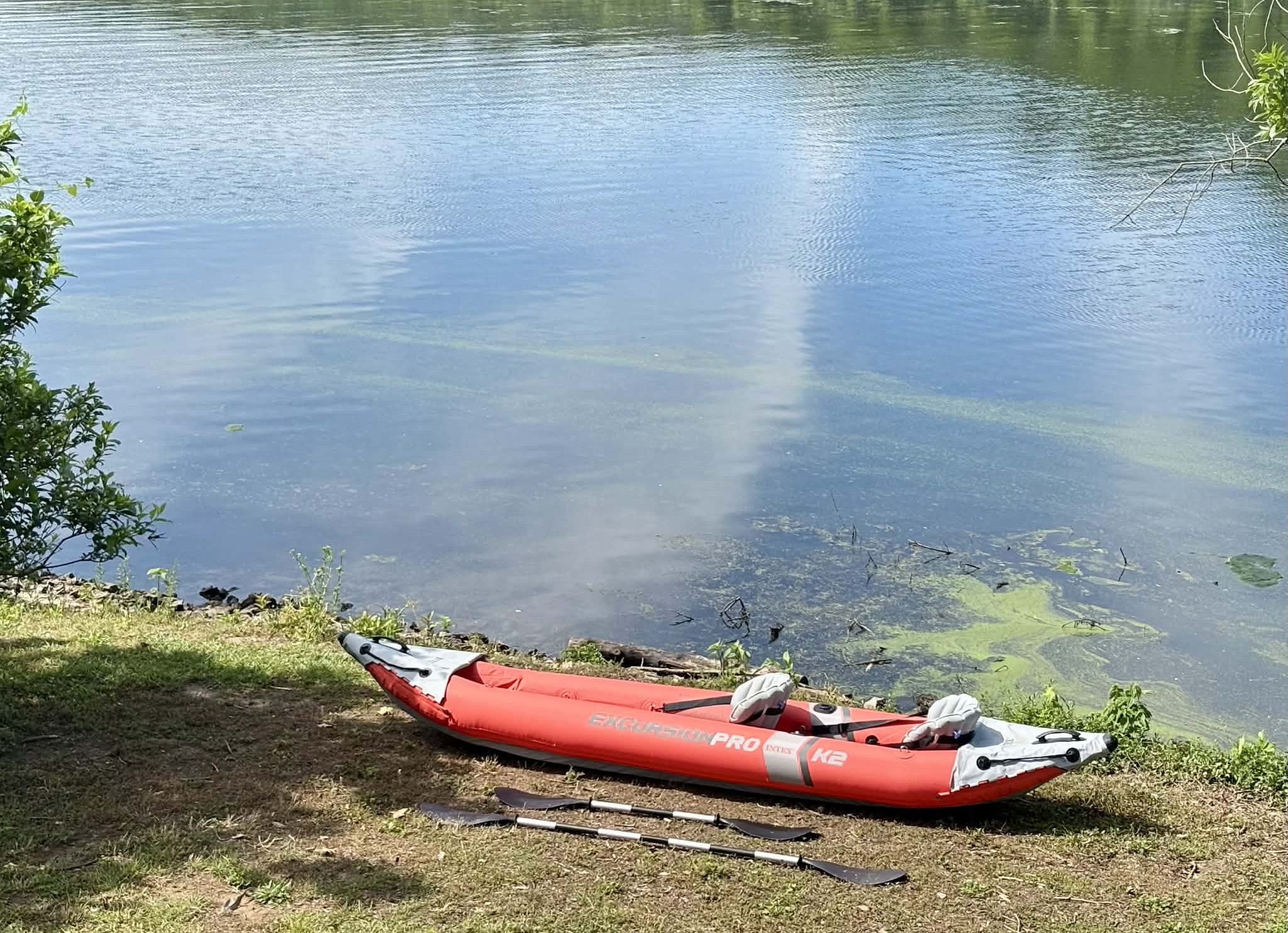 2 person kayak with fishing pole holders and 2 life jackets provided at house