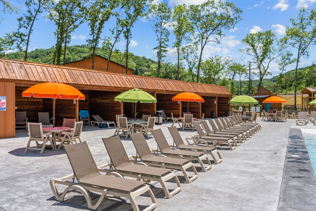 Plenty of lounge chairs and tables with umbrellas for everyone to enjoy.