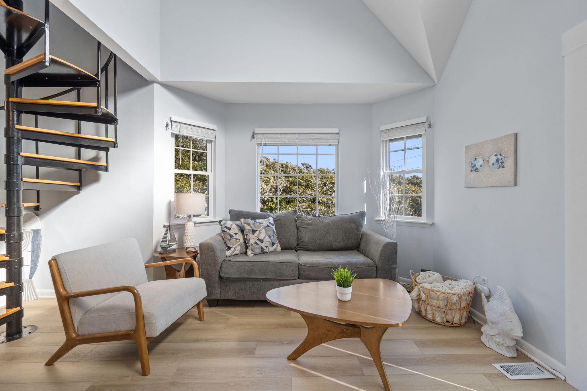 Relax in style on a comfy couch surrounded by coastal charm.