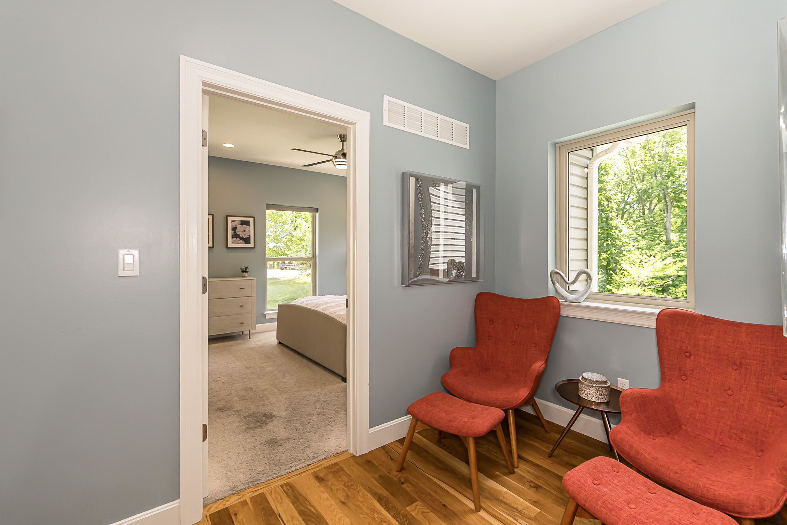 Seating area across from the computer desk and outside bedroom 2