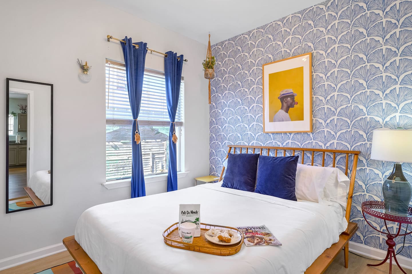 Enjoy breakfast in bed in the 'Blue Room' featuring a plush queen mattress and funky decor. 