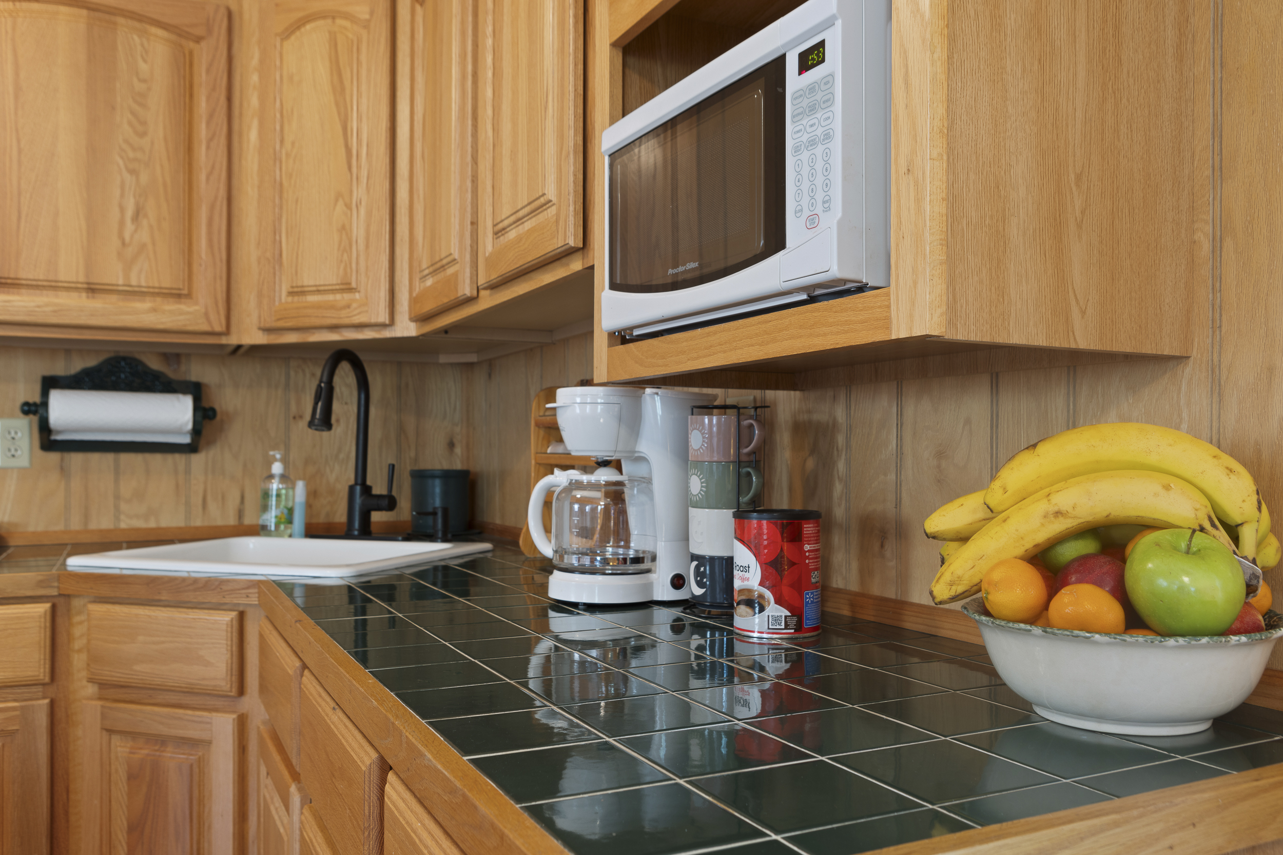 Kitchen: Enjoy cooking with a bright space, modern appliances, and fresh fruit at your fingertips!