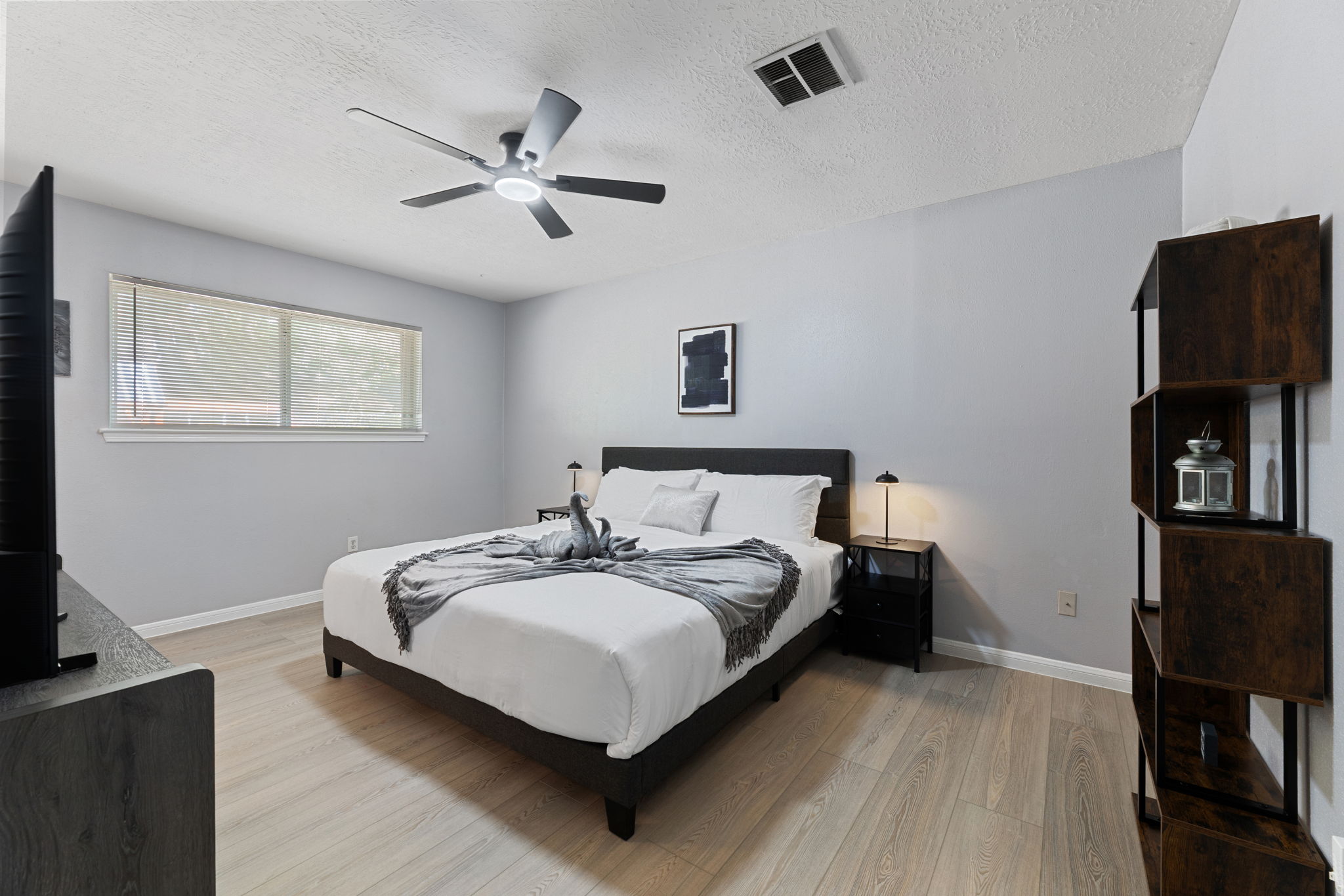 Retreat to the luxurious master suite with a king bed, private bath, and TV for ultimate comfort and privacy.