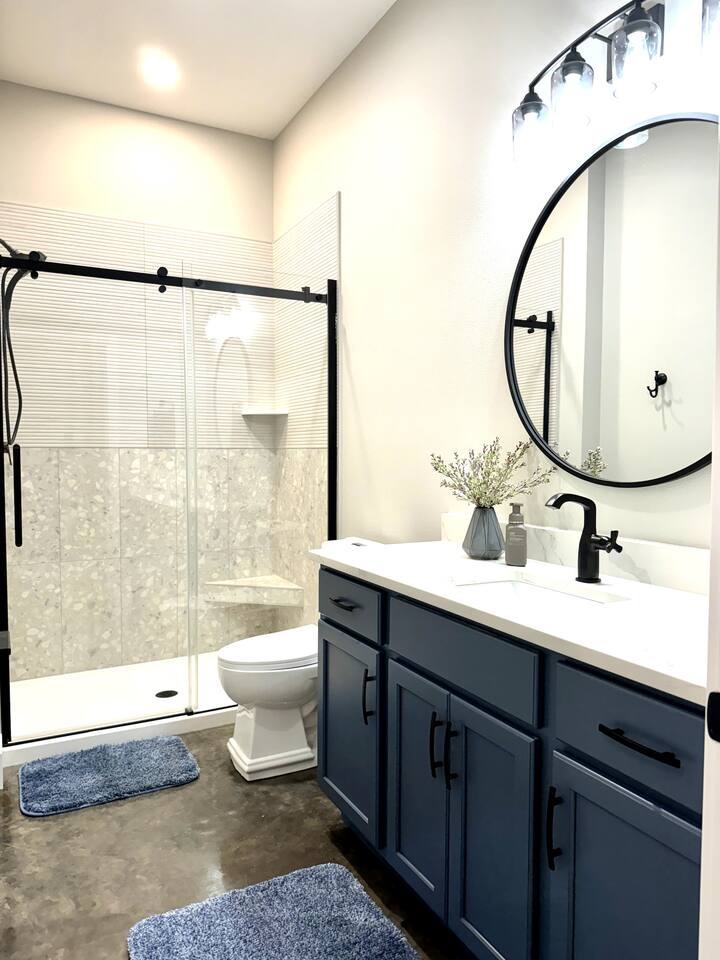 Beautifully tiled and tastefully decorated bathroom for a serene bathroom experience. 