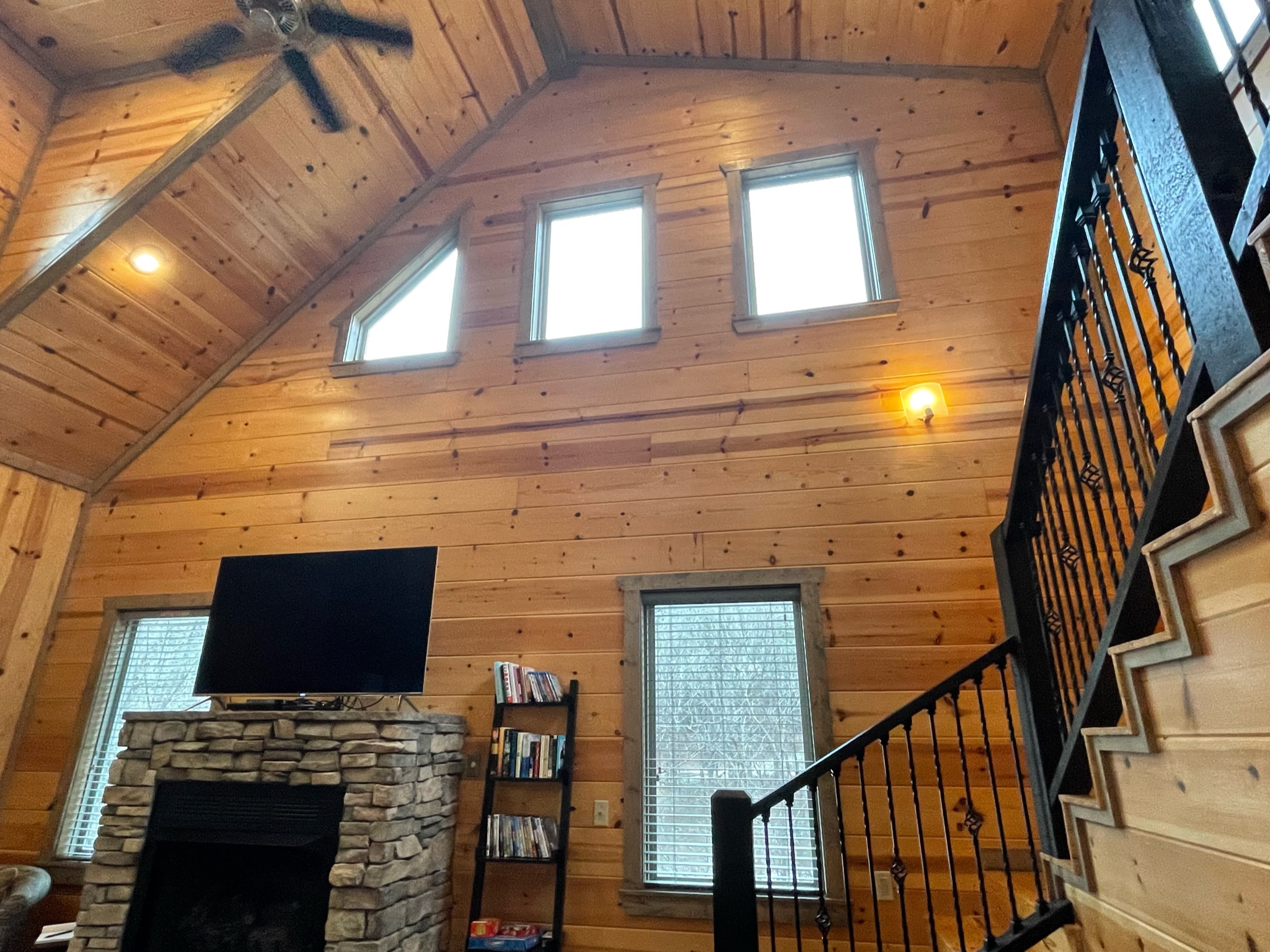 The living room with many high windows for excellent light.