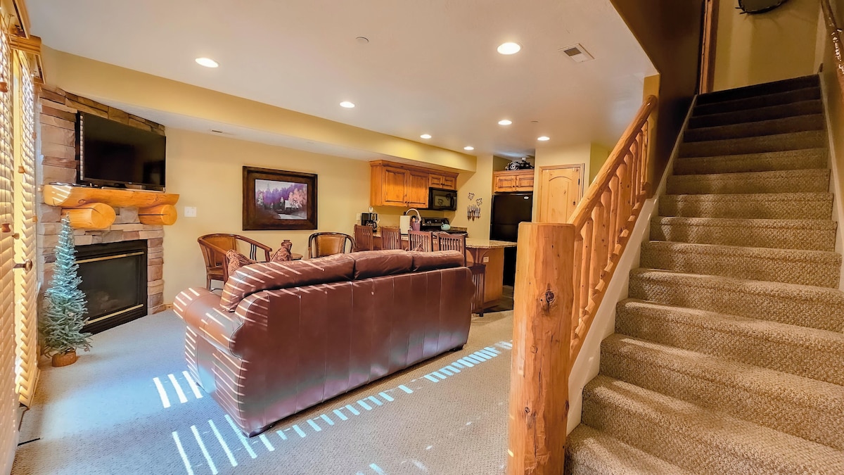 The living room, freshly appointed with new furniture, offers easy access to the outdoor deck.