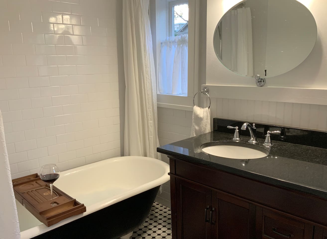 Clawfoot tub for soaking or showering. Lots of counter space and under counter storage.