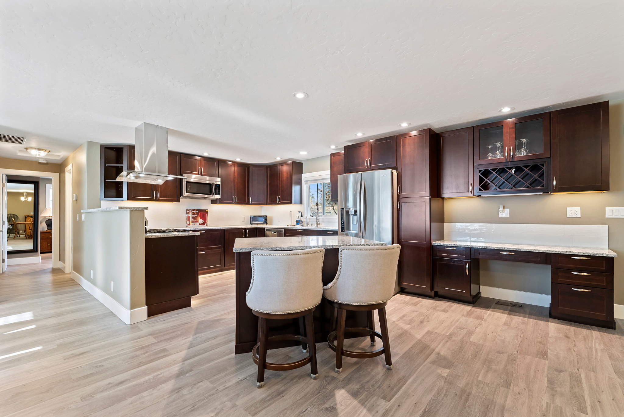 Fully upgraded kitchen featuring an open-concept design, making it easy for guests to move around and gather comfortably.