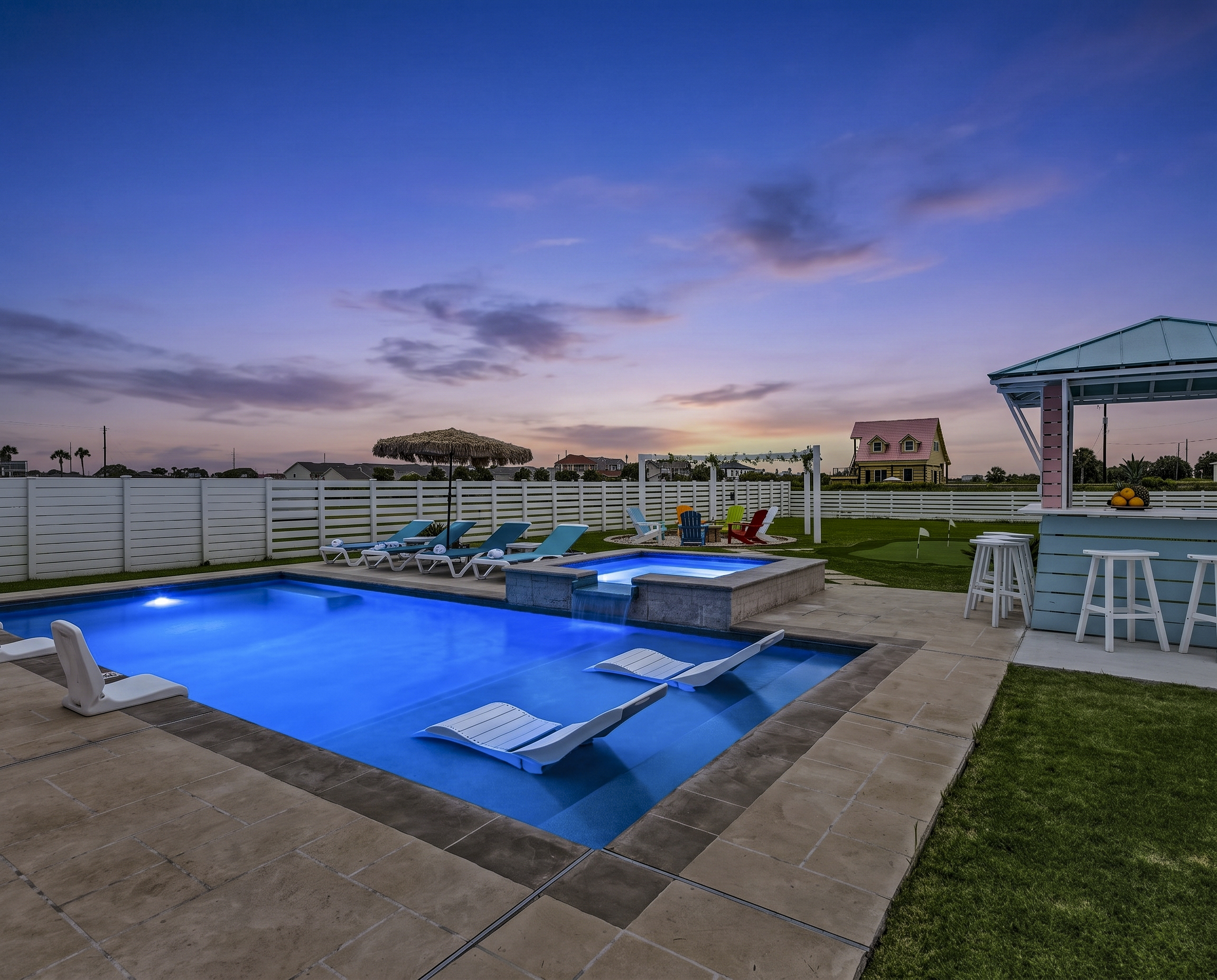 Evening Resort Ambiance
The illuminated blue pool and heated spa create a luxurious nighttime atmosphere, offering the perfect place to unwind after a day at the beach.