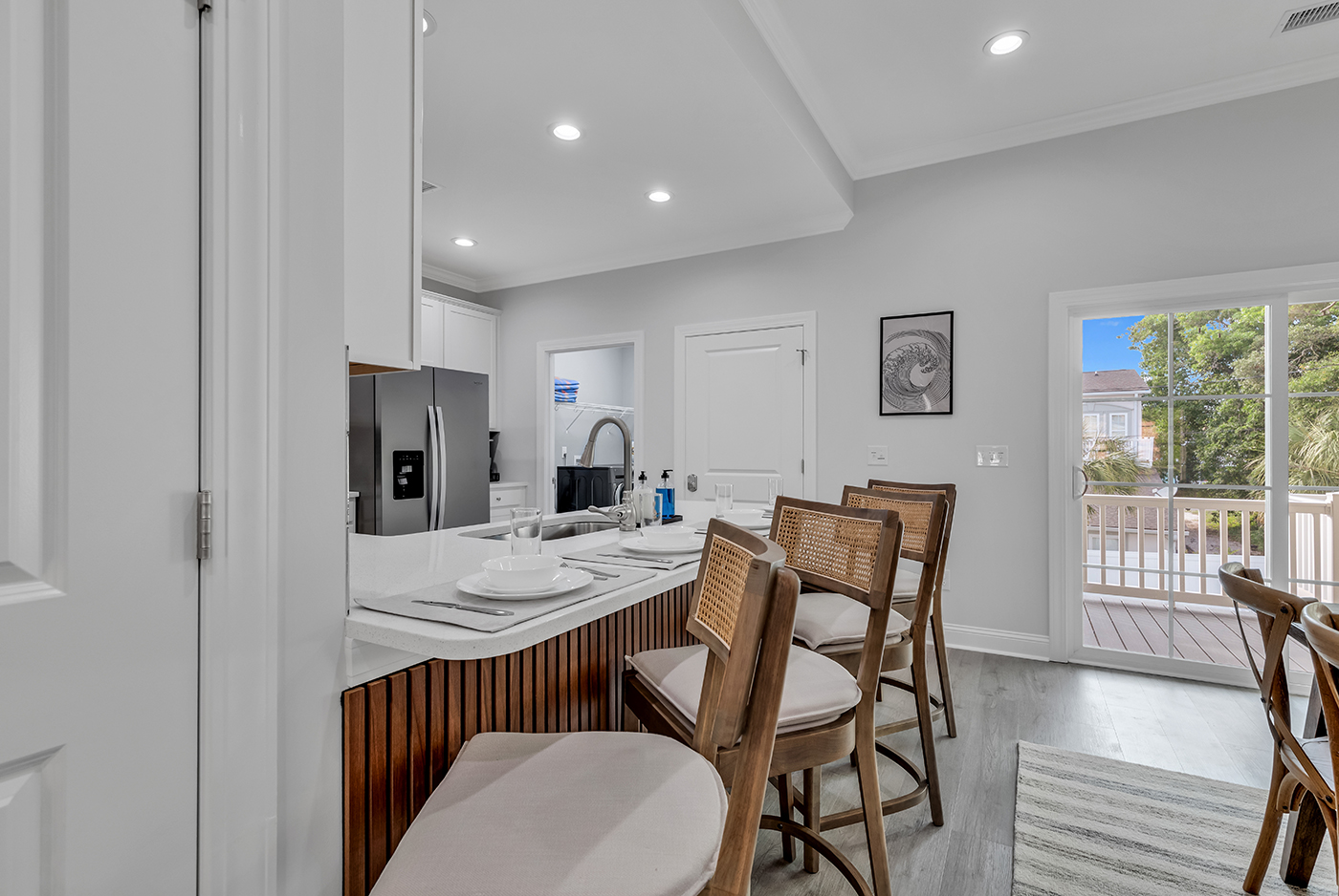 With a generously sized dining table seating 8 and additional seating for 4 at the island, there's room for everyone to come together. Enjoy shared meals and conversations in this welcoming sp