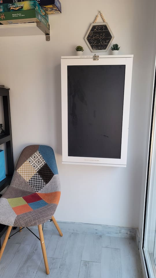 Cabinet with emergency supplies that converts into a desk. 