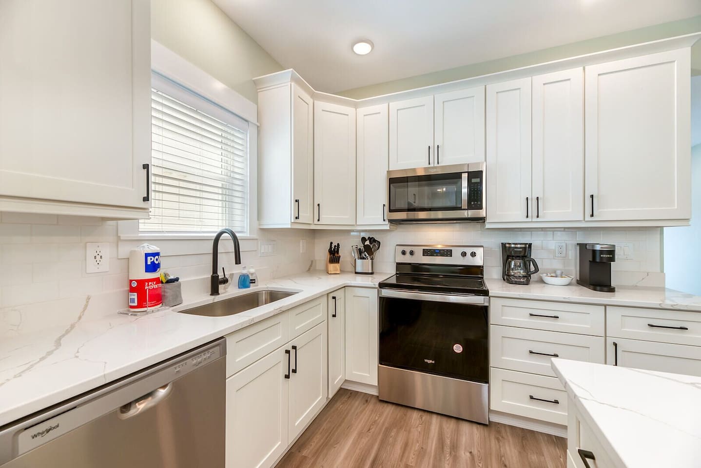 Beautifully designed kitchen with ample cabinetry, counter space, and coastal charm.