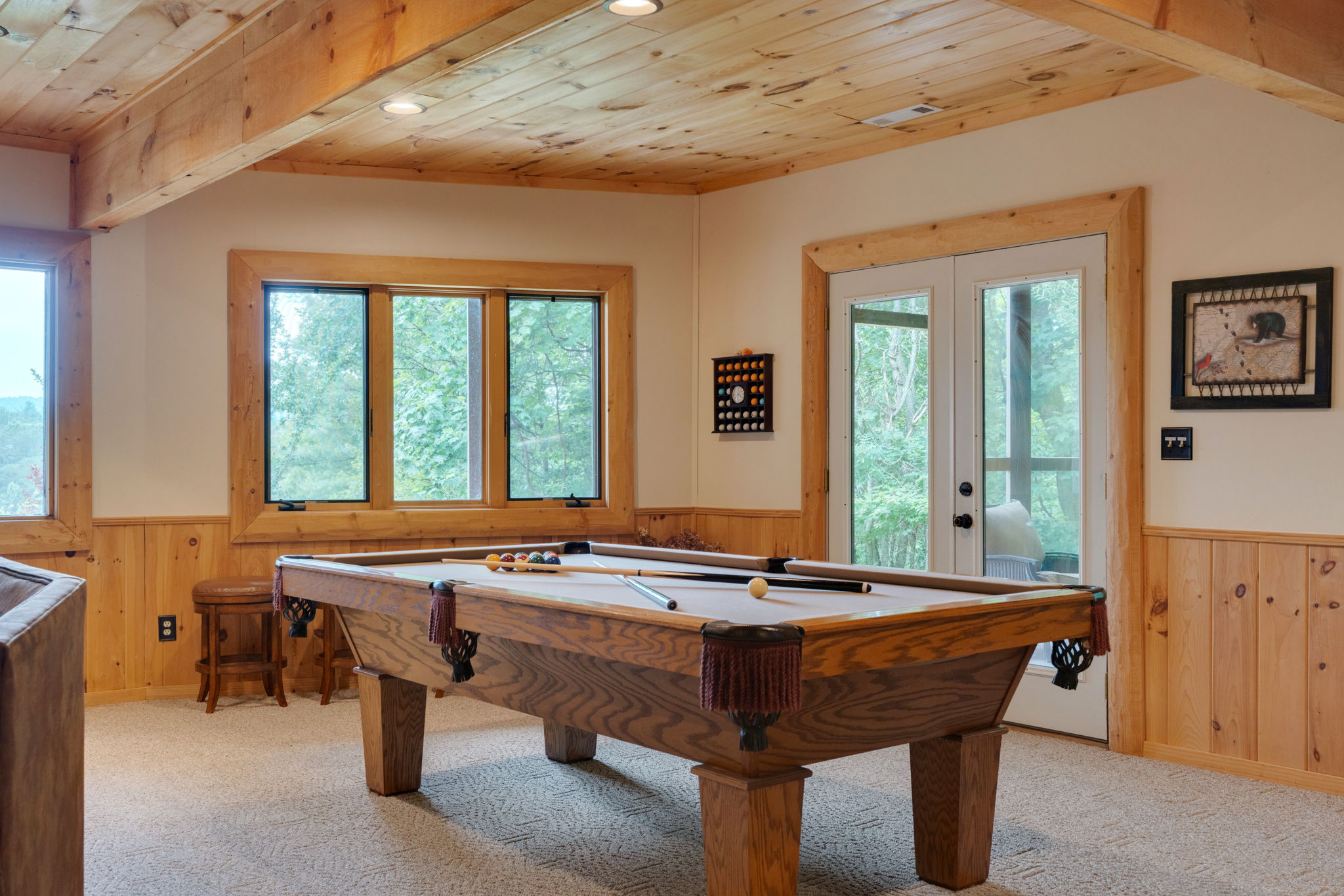 Full size pool table is located in the basement game room.
