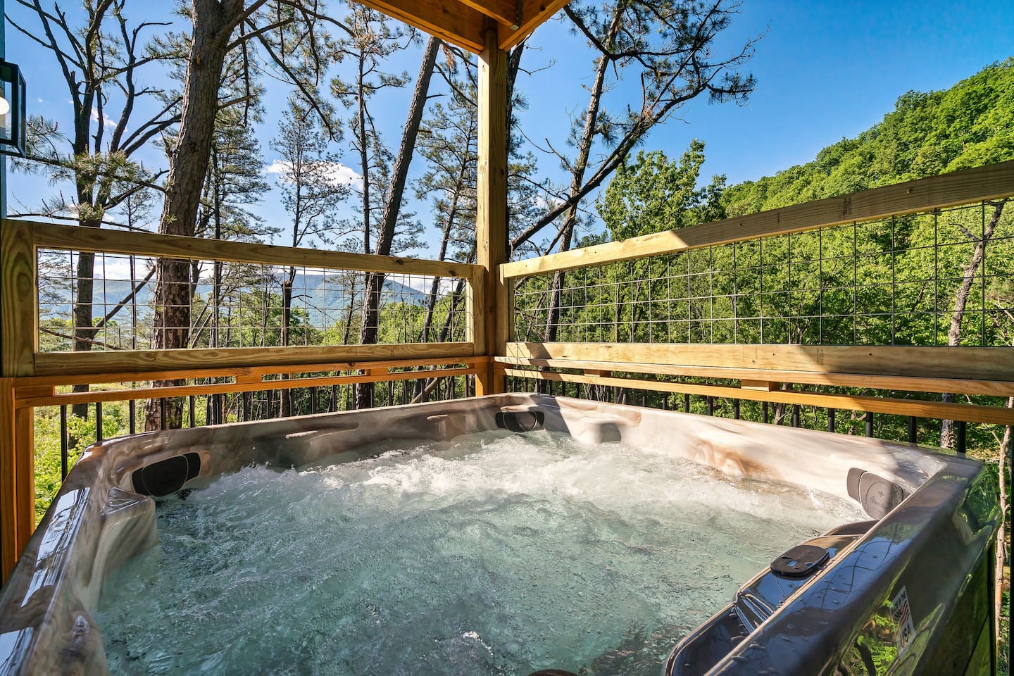 Unwind in your private hot tub with panoramic forest views — modern comfort meets mountain serenity.