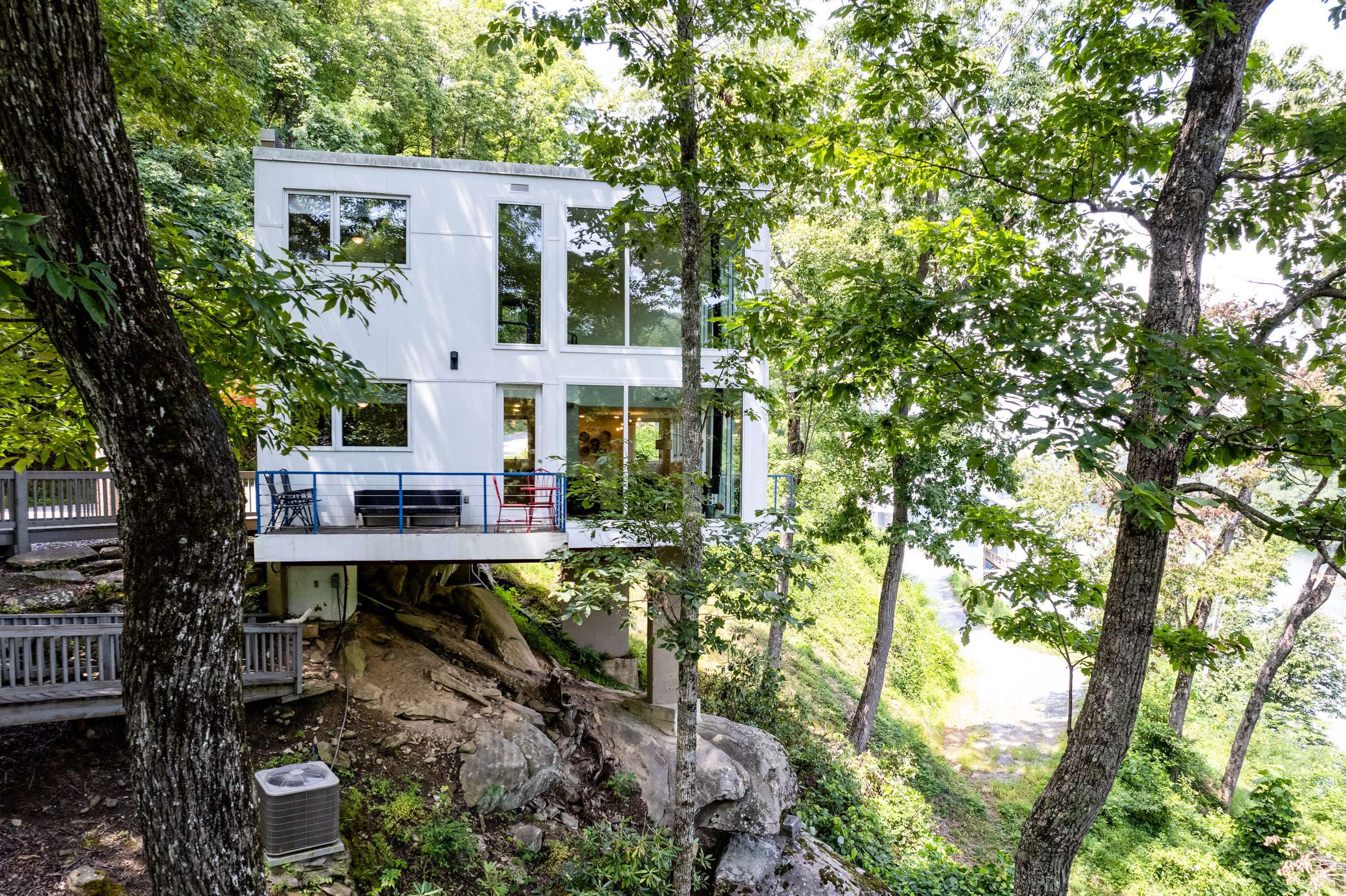 A beautiful view of the side of the house. This really shows the unique nature of the building site. 