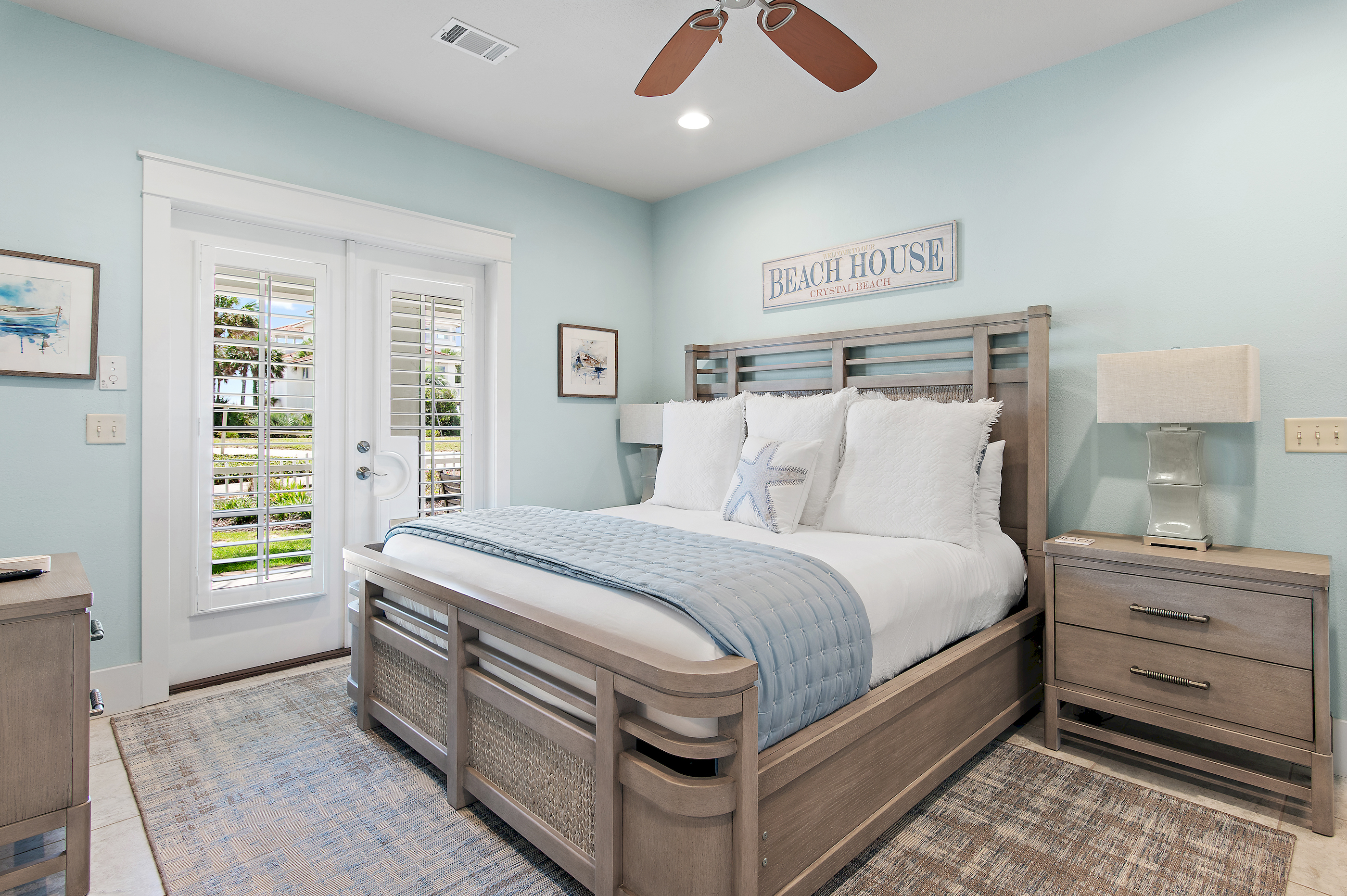 Relax in this beautifully appointed coastal bedroom, featuring a comfortable king bed and soothing beach inspired décor.