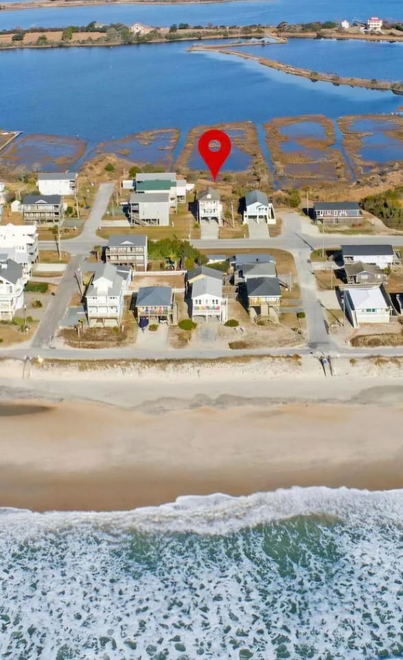 Water views from the front and back of the house! Beach access is 50 seconds away. Wide open semi-private beachs because there aren'' public parking lots around. Wide open sandy beachs, fnext to Andrew's Produce Stand