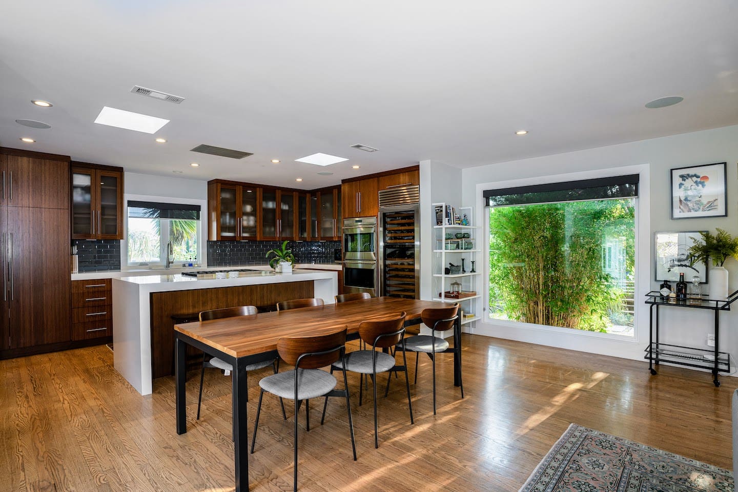 Fully stocked chef's kitchen with 8 person dining table and two person island seating.