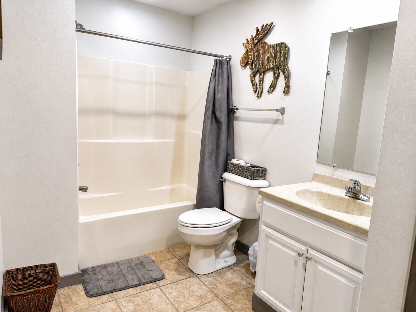 At the top of the stairs, just steps from the three upstairs bedrooms, you’ll find a conveniently located full bathroom with a shower/tub combination, making mornings and bedtime easy for families and groups.