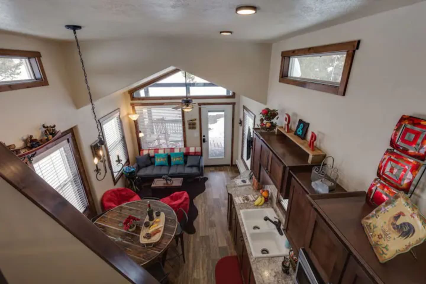View of living, dining and kitchen area from loft