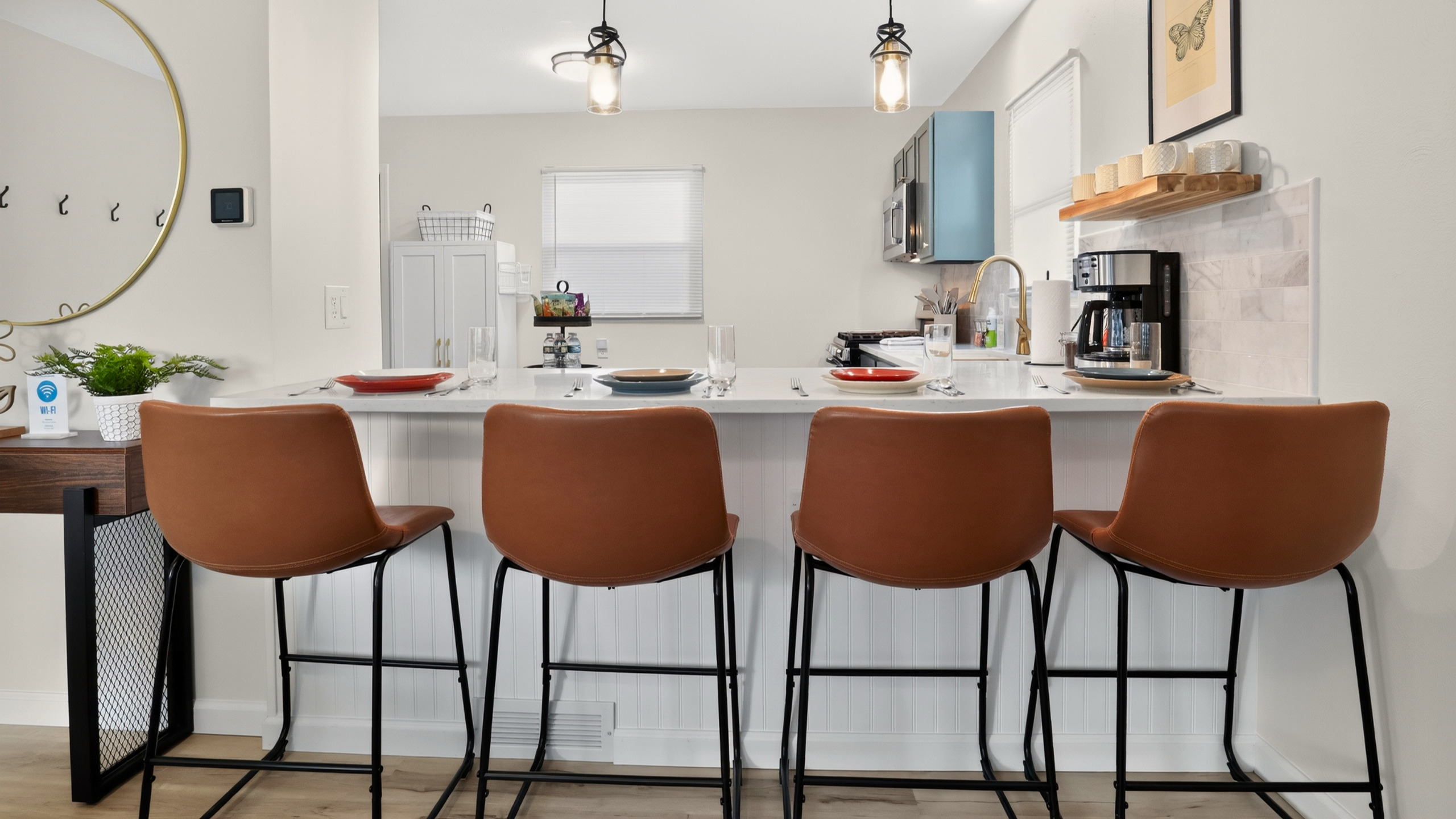 The kitchen island is a favorite spot for coffee, conversation, and casual meals.