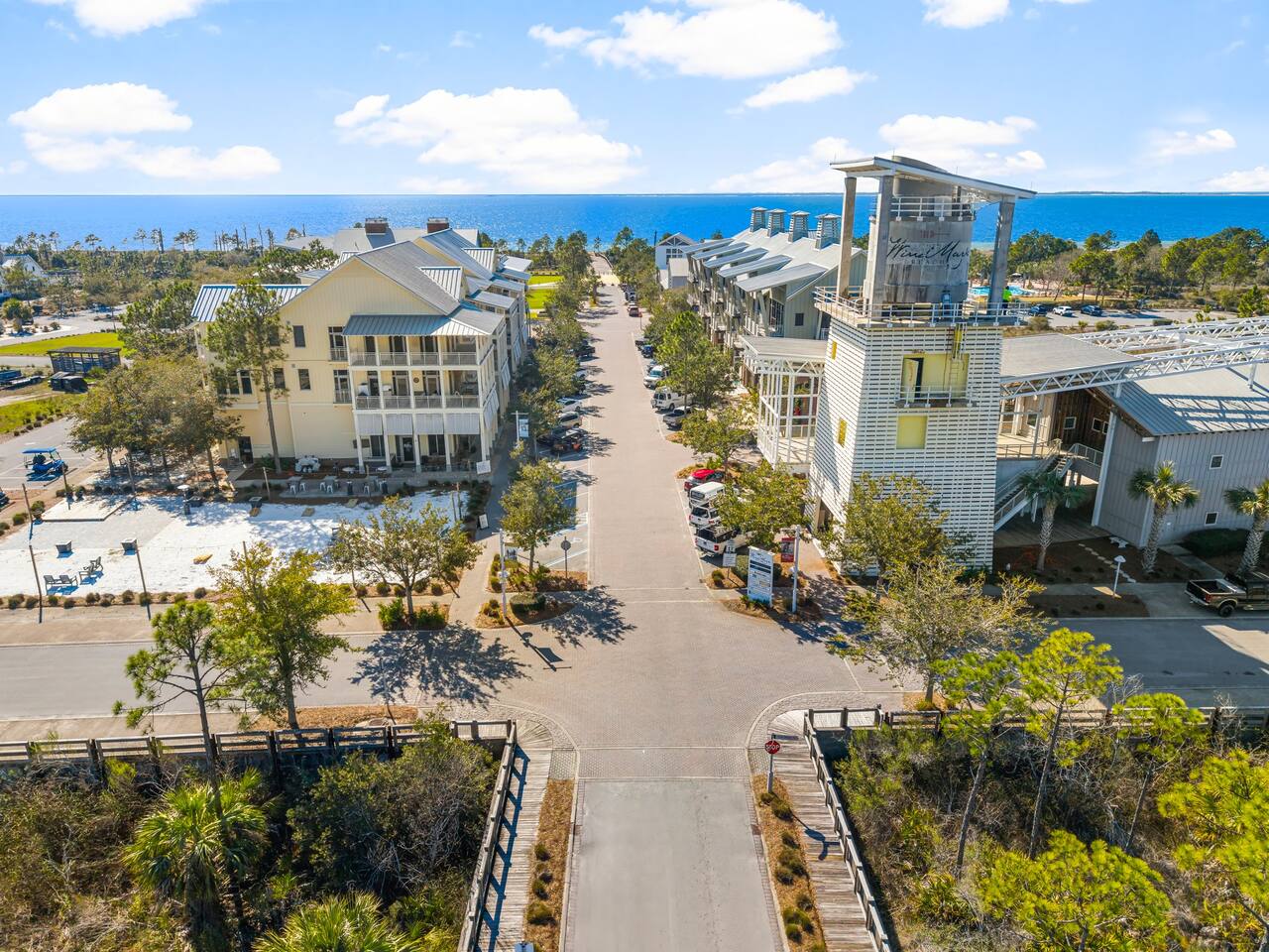 Community Town Center with dining, beach access, community pool, live entertainment, cafe, and candy shop | 5 min walk from home
