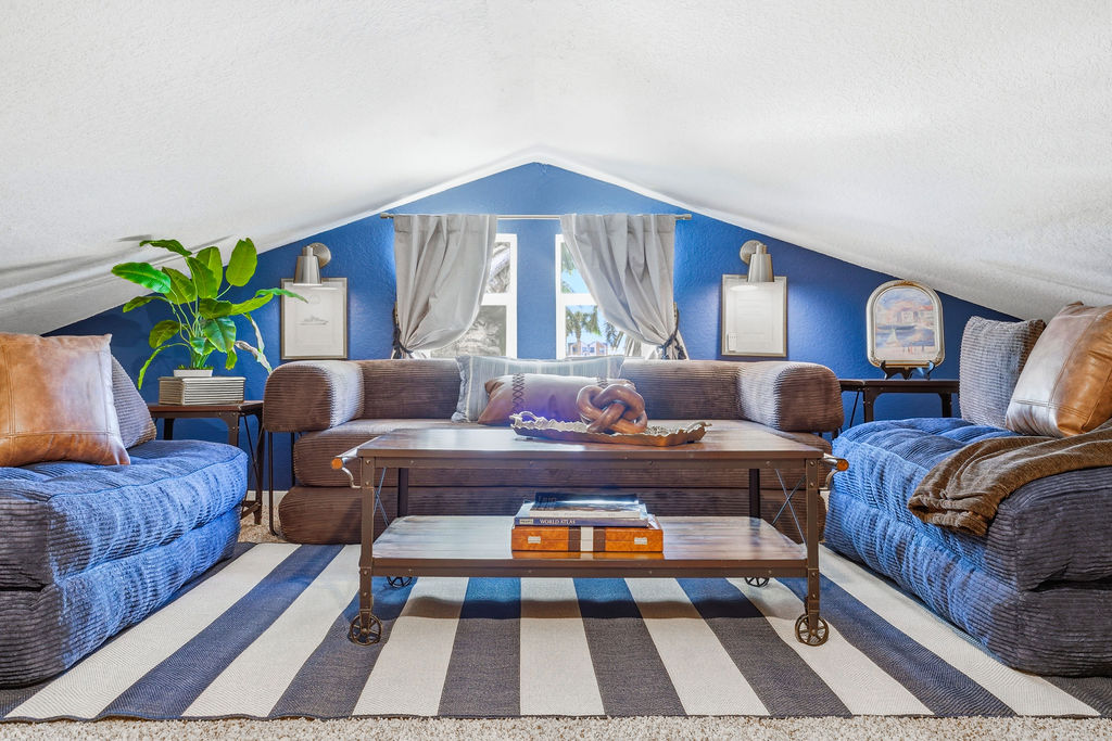 The loft is a cozy hideaway for relaxing, reading, or gathering the crew for a laid-back evening.