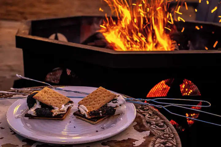 Toast s'mores over the fire once the sun's down — the easy, screen-free wind-down after a full day in Hot Springs.