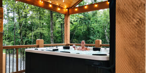Covered hot tub with serene forest surroundings