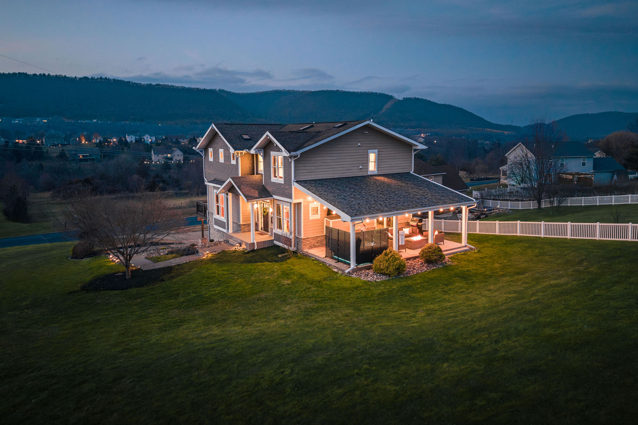 Aerial twilight view showcasing the home’s size, privacy, and peaceful setting — a rare combination just minutes from Penn State.