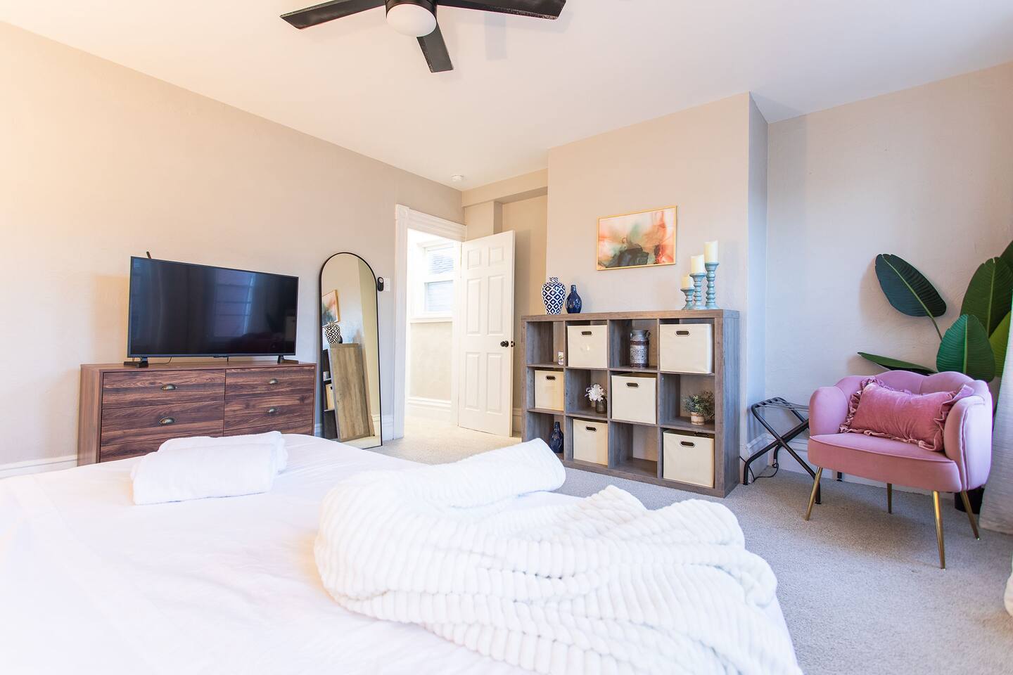 In the King Bedroom, store your belongings in the dresser and cubbies with baskets in the cube storage unit.