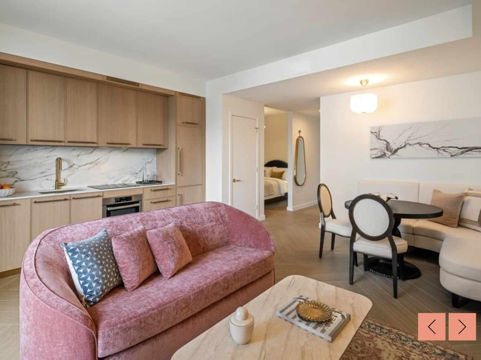Open-concept living + kitchen — chef's kitchen with breakfast island and pampas accents
