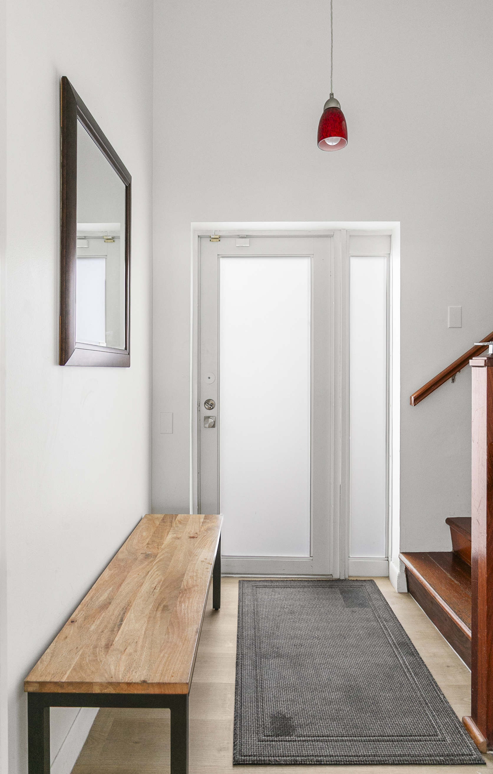 Private entrance foyer with storage space, easily accessible beach gear, and a bench