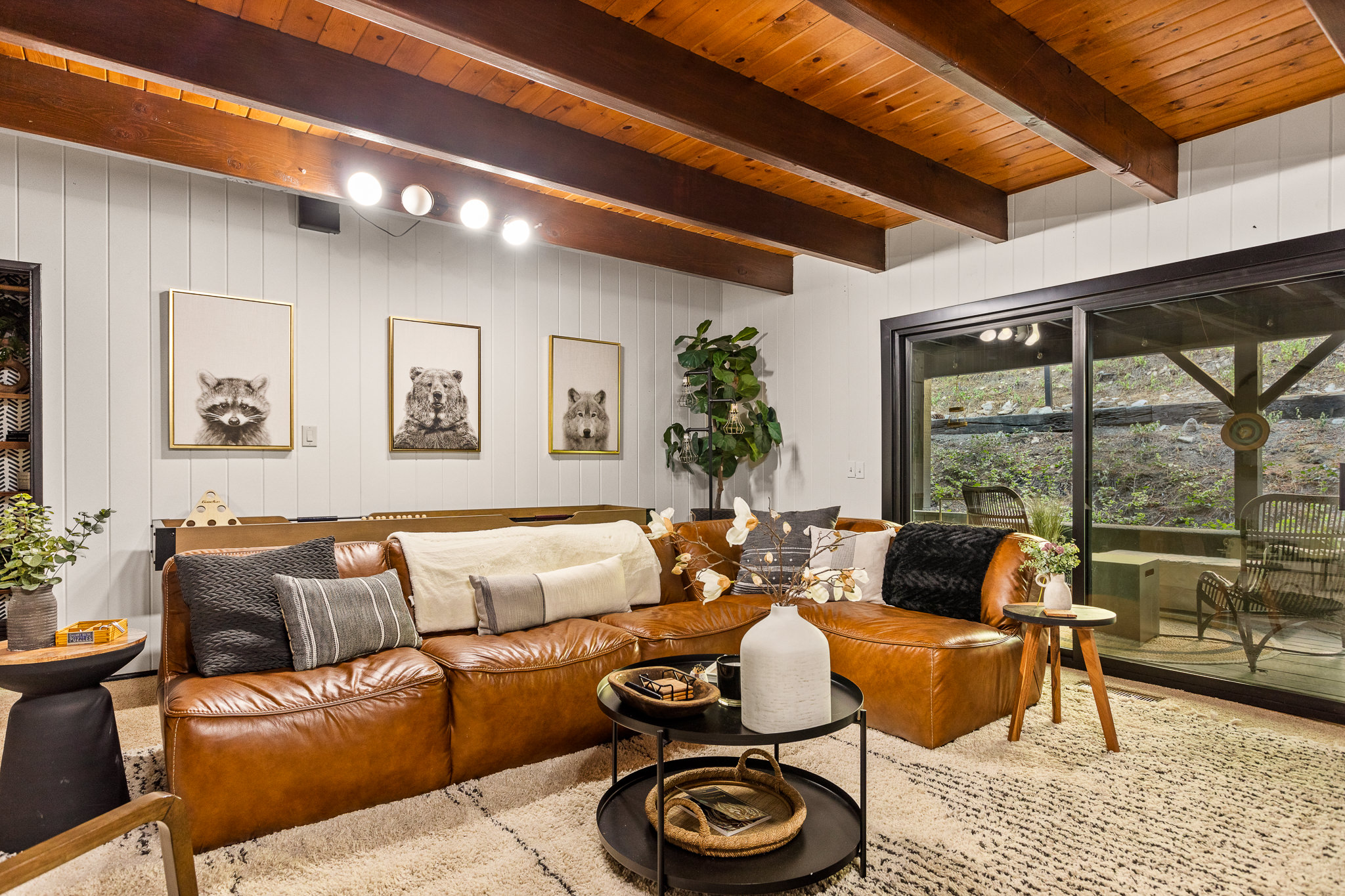 The downstairs family room is your ideal haven for games, socializing, or simply cuddling up to enjoy a movie in front of the warm fire!