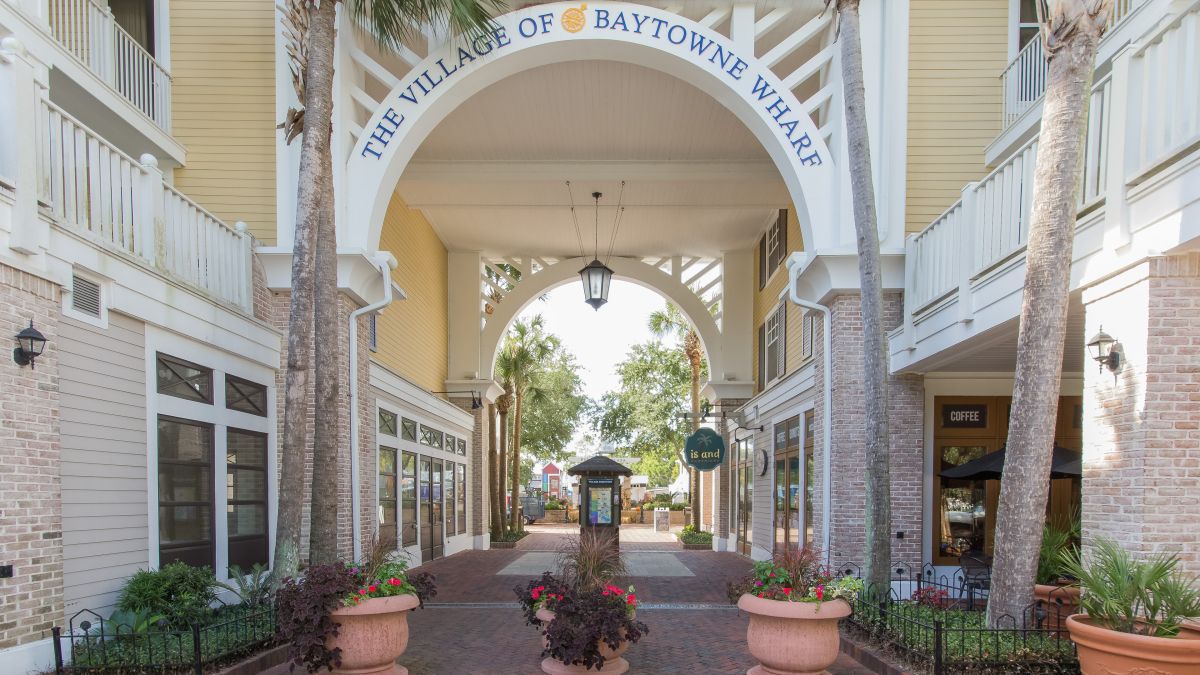 The Village of Baytowne Wharf entrance archway, steps from the front door